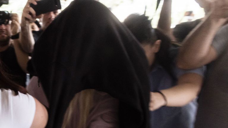 This picture taken on July 29, 2019 shows a British teenager who accused seven Israelis of gang rape arriving at the Famagusta District Court in Paralimni in eastern Cyprus, to face charges of making a false allegation. - Initially, the 19-year-old woman had alleged that 12 Israelis gang raped her at the hotel where she was staying in the popular Ayia Napa resort on July 17. The young Israeli tourists were remanded in custody the next day. But hours before their second appearance in court five of them were released and sent home late the next day. (Photo by Iakovos Hatzistavrou / AFP)        (Photo credit should read IAKOVOS HATZISTAVROU/AFP/Getty Images)