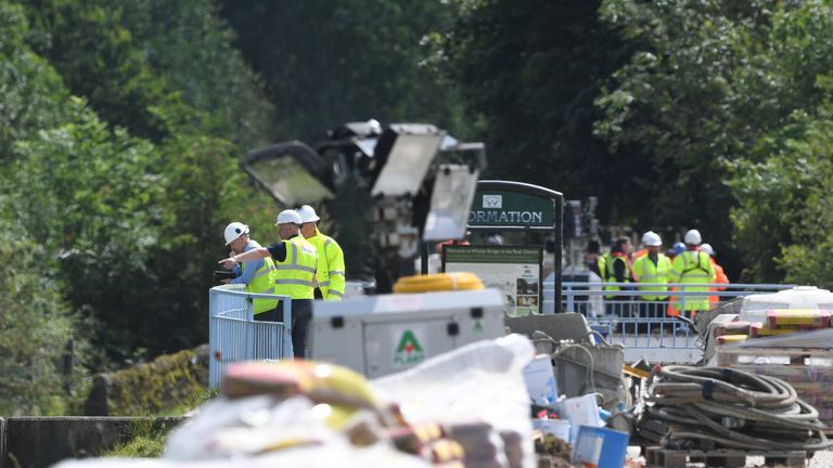 Work continues to shore up the dam at Toddbrook Reservoir near the village of Whaley Bridge, Derbyshire, after it was damaged in heavy rainfall.