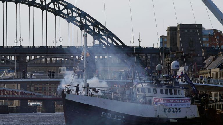 NEWCASTLE, ENGLAND - MARCH 15: A boat releases a flare near the Millennium Bridge on the River Tyne during the Fishing For Leave flotilla on March 15, 2019 in Newcastle, United Kingdom. Fishing for Leave are supporting other Pro-Brexit groups who are calling for the Government to scrap the Withdrawal Agreement and for MP's to ensure that Britain leaves the EU with no deal. The flotilla marks the official launch of the 'March to Leave' walk that begins the following day and will make its way to London in 14 stages arriving on March 29, the original date for the UK to leave the European Union.(Photo by Christopher Furlong/Getty Images)