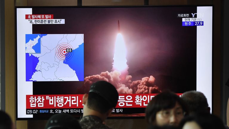 People watch a television news screen showing file footage of North Korea's missile launch, at a railway station in Seoul on August 10, 2019. - North Korea fired two "unidentified projectiles" on August 10, into the sea, South Korea's Yonhap news agency reported, citing the country's Joint Chiefs of Staff -- the latest in a series of such launches by Pyongyang. (Photo by Jung Yeon-je / AFP)        (Photo credit should read JUNG YEON-JE/AFP/Getty Images)