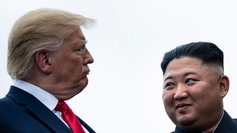 TOPSHOT - US President Donald Trump and North Korea&#39;s leader Kim Jong-un talk before a meeting in the Demilitarized Zone(DMZ) on June 30, 2019, in Panmunjom, Korea. (Photo by Brendan Smialowski / AFP)        (Photo credit should read BRENDAN SMIALOWSKI/AFP/Getty Images)