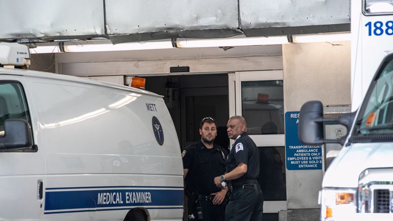 Police officers stand outside New York Presbyterian-Lower Manhattan Hospital, where Jeffrey Epstein's body was transported before being moved to Medical examiners Office in Manhattan borough of New York City, New York, U.S., August 10, 2019. REUTERS/Jeenah Moon