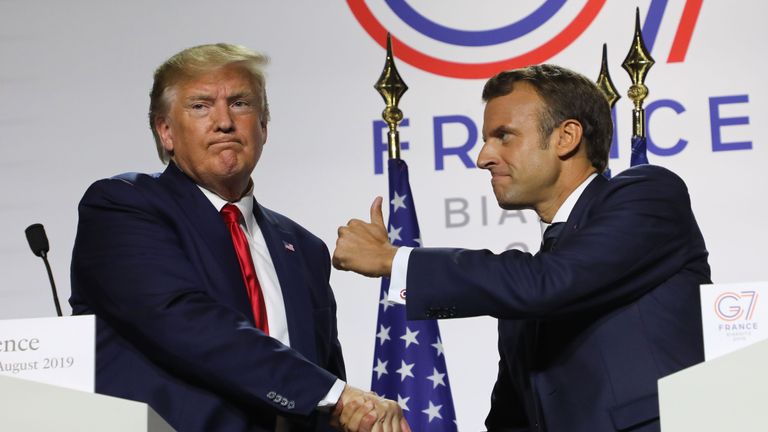 TOPSHOT - France's President Emmanuel Macron (R) and US President Donald Trump shake hands during a joint-press conference in Biarritz, south-west France on August 26, 2019, on the third day of the annual G7 Summit attended by the leaders of the world's seven richest democracies, Britain, Canada, France, Germany, Italy, Japan and the United States. (Photo by ludovic MARIN / AFP)        (Photo credit should read LUDOVIC MARIN/AFP/Getty Images)