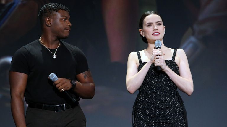 ANAHEIM, CALIFORNIA - AUGUST 24: (L-R) John Boyega and Daisy Ridley of &#39;Star Wars: The Rise of Skywalker&#39; took part today in the Walt Disney Studios presentation at Disney’s D23 EXPO 2019 in Anaheim, Calif.  &#39;Star Wars: The Rise of Skywalker&#39; will be released in U.S. theaters on December 20, 2019. (Photo by Jesse Grant/Getty Images for Disney)