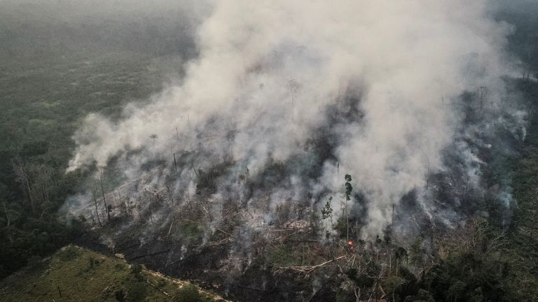 An aerial view of a tract of the Amazon jungle burning as it is being cleared by loggers and farmers in Porto Velho, Rondonia State, Brazil, is pictured in this August 23, 2019 picture taken with a drone. Picture taken August 23, 2019.  REUTERS/Ueslei Marcelino
