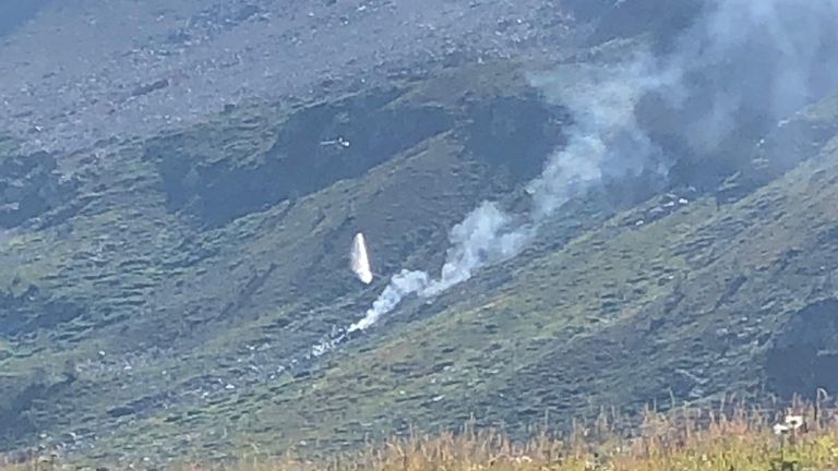 Smoke is seen at the site of a plane crash at the Simplon Pass in Switzerland, in this picture released by Police Cantonale du Valais on August 25, 2019. Police Cantonale du Valais/Handout via REUTERS  THIS IMAGE HAS BEEN SUPPLIED BY A THIRD PARTY.