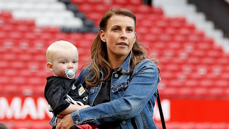 Coleen Rooney with son Kit after the Premier League match at Old Trafford, Manchester.