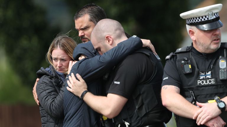 Members of the Thames Valley and Hampshire Roads Policing Team pay their respects at the scene near where PC Andrew Harper was killed