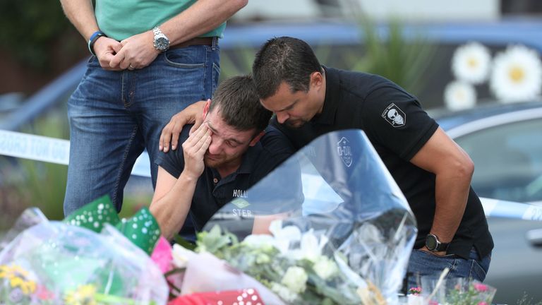 Members of the Thames Valley and Hampshire Roads Policing Team pay their respects at the scene near to where PC Andrew Harper was killed