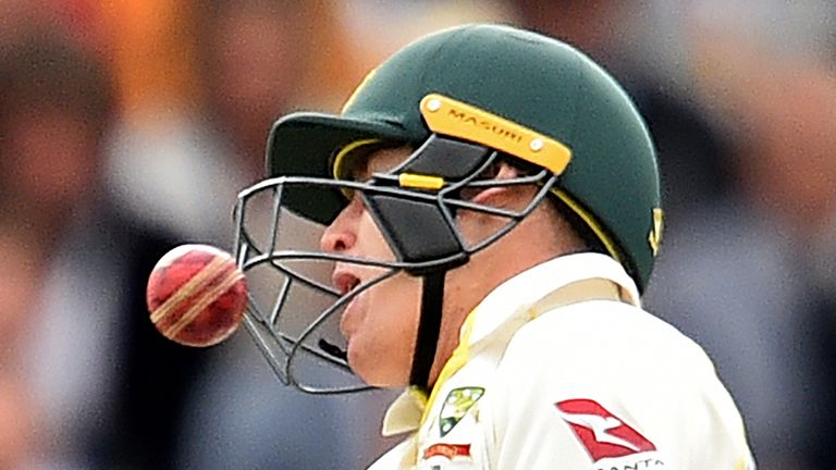 Australia&#39;s Marnus Labuschagne reacts as the ball, bowled by England&#39;s Jofra Archer (unseen) hits him on the helmet 