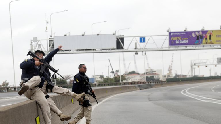 Federal police officers at the Rio-Niteroi Bridge, where armed police surrounded a hijacked passenger bus in Rio de Janeiro, Brazil