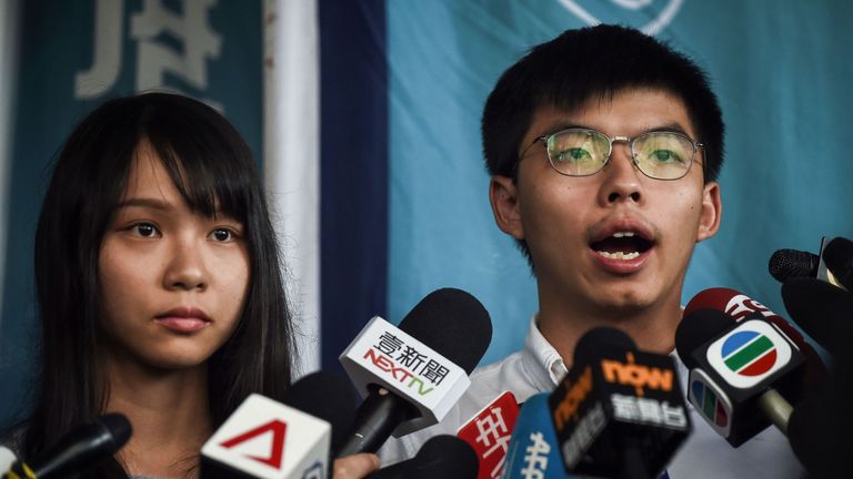 HONG KONG, CHINA - AUGUST 30: Hong Kong pro-democracy activists Agnes Chow (L) and Joshua Wong speak to the media after being arrested and released on bail on August 30, 2019 in Hong Kong, China