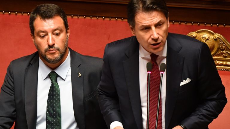 Italian Prime Minister Giuseppe Conte (R), flanked by Deputy Prime Minister and Interior Minister Matteo Salvini (L), delivers a speech at the Italian Senate, in Rome, on August 20, 2019