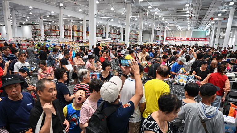 People visit the first Costco outlet in China, on the stores opening day in Shanghai on August 27, 2019