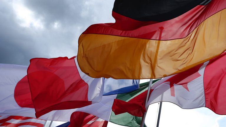 The flags of the G7 countries the US, Japan, France, Britain, Italy, Canada and Germany flutter in the wind near the Schloss Elmau castle resort near Garmisch-Partenkirchen, in southern Germany, where is being held a G7 summit on June 7, 2015. AFP PHOTO / DPA / KARL-JOSEF HILDENBRAND   +++   GERMANY OUT        (Photo credit should read KARL-JOSEF HILDENBRAND/AFP/Getty Images)
