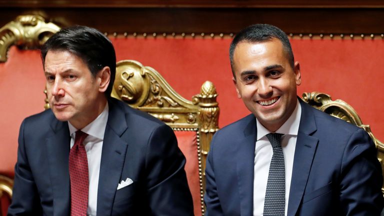 Italian Deputy Prime Minister and Labour Minister Luigi di Maio and Italian Prime Minister Giuseppe Conte react during a session of the upper house of parliament