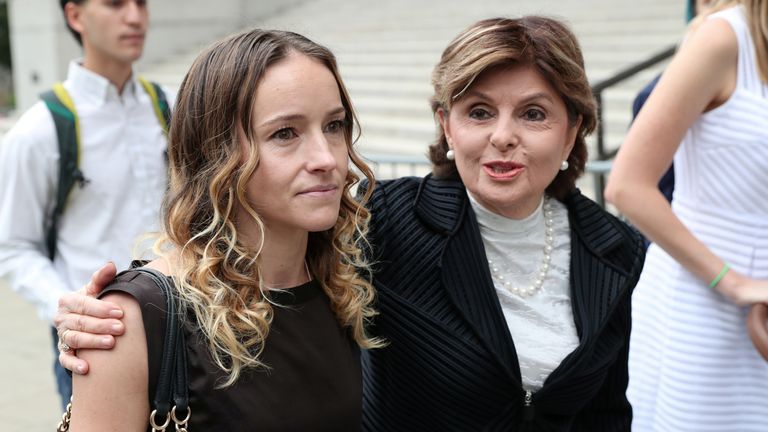 Lawyer Gloria Allred, who is representing alleged victims of Epstein, arrives at court with an unidentified women