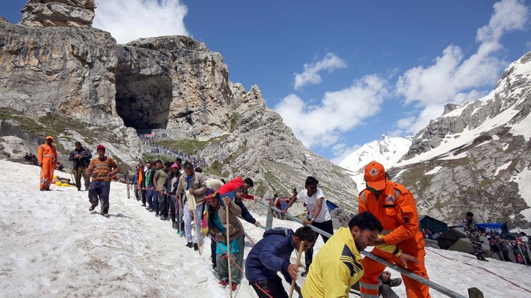 Hindu pilgrims leave the holy cave of Lord Shiva after worshipping in Amaranth, southeast of Srinagar. File pic