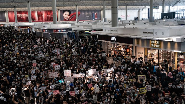 The departure hall is crammed with protesters