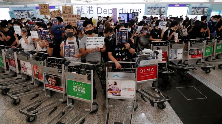 Protesters barricaded themselves in with luggage trolleys