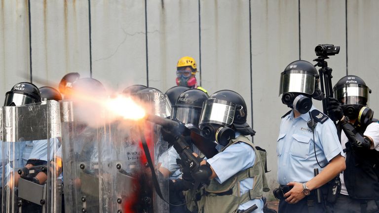 Police officers fire tear gas as anti-extradition bill protesters demonstrate in Sham Shui Po neighbourhood in Hong Kong, China, August 11, 2019. 