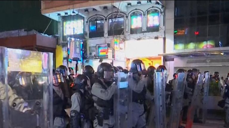 Riot police push along Hong Kong streets