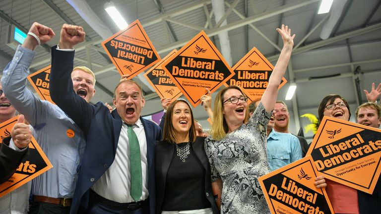 Liberal Democrat MP Jane Dodds, centre, celebrates with supporters