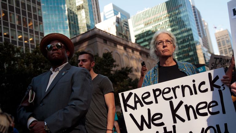 Activists rally in support of NFL quarterback Colin Kaepernick outside the offices of the National Football League on Park Avenue, August 23, 2017