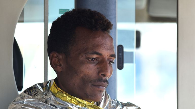 One of the migrants who jumped off the ship is pictured after arriving on Lampedusa 