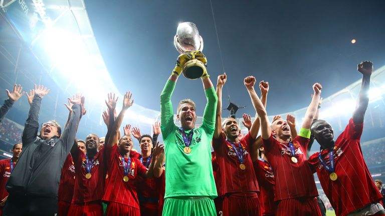 Adrian lifts the UEFA Super Cup after his penalty save won the trophy for Liverpool