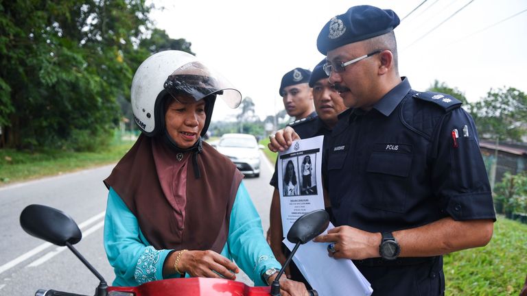Malaysian police have been giving leaflets to drivers as part of the search for Nora