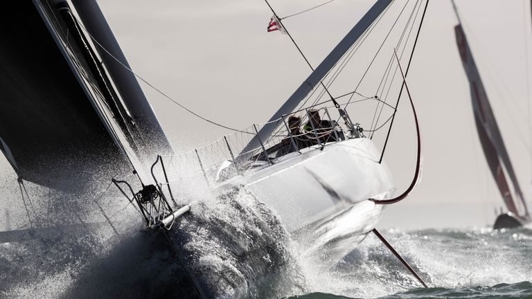 A Malizia II racing yacht sailing upwind during the Transat Jaques Vabre in 2017