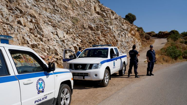 Police officers block the road towards the area where the body of Natalie Christopher was found
