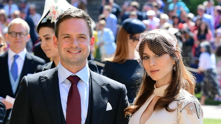 Suits actor Patrick J Adams and wife Troian Bellisario at Windsor Castle before the wedding of Prince Harry to Meghan Markle on May 19, 2018