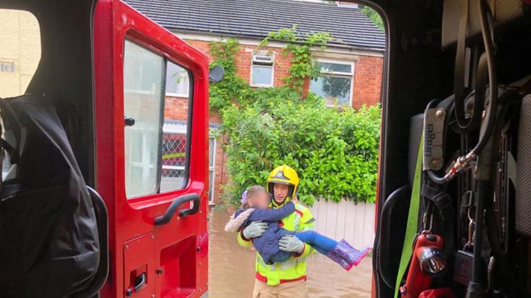 A girl is carried to safety. Pic: Poynton Fire Station
