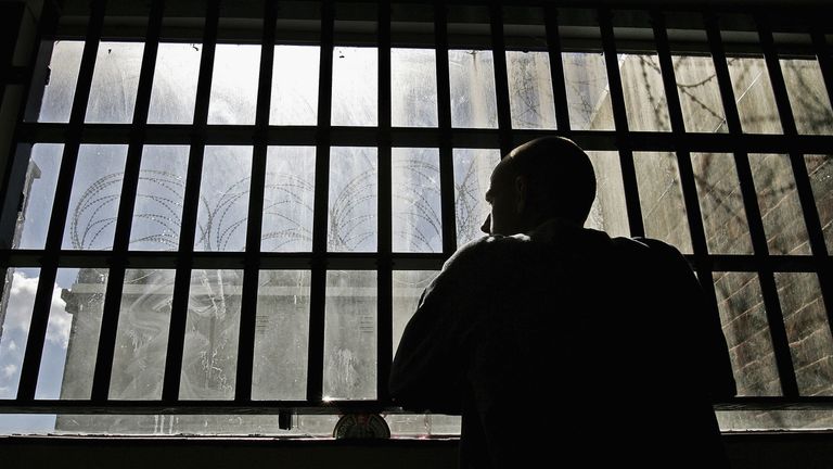 NORWICH, UNITED KINGDOM - AUGUST 25:  (EDITORS NOTE: IMAGES EMBARGOED FOR PUBLICATION UNTIL 0001GMT AUGUST 26, 2005) 19 year old inmate James looks out of the window of the Young Offenders Institution attached to Norwich Prison on August 25, 2005 in Norwich, England. 