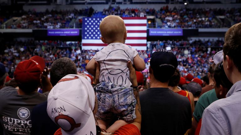 In the summer of 2018, QAnon followers started to appear at  Donald Trump rallies 