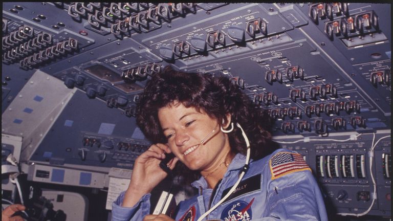 Sally Ride communicates with ground controllers from the flight deck during the 1983 Challenger mission