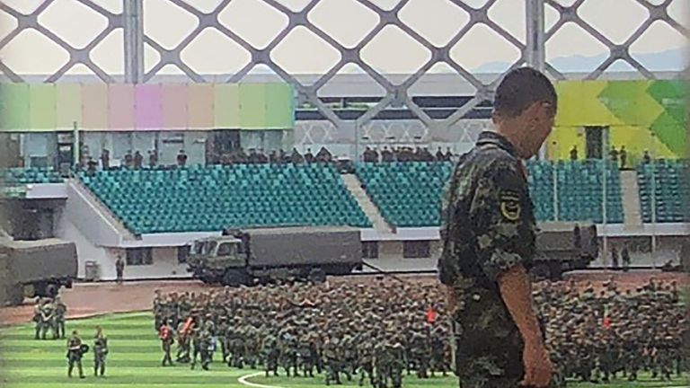 Chinese military personnel gather inside Shenzhen Bay stadium in Shenzhen, bordering Hong Kong