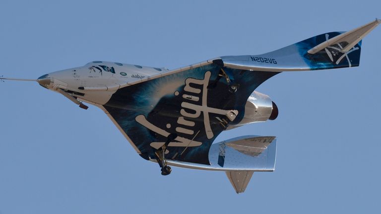 Virgin Galactic & VSS Unity is coming to a landing after its sub-orbital test flight on December 13, 2018 in Mojave, California. - Virgin Galactic scored a major milestone on Thursday as its spacecraft reached its maximum altitude, or apogee, of 51.7 miles (82.7 kilometers) after taking off attached to an airplane from Mojave, California, then firing its rocket motors to reach new heights. (Photo by Gene Blevins / AFP) (Photo credit should be read on GENE BLEVINS / AFP / Getty Images)