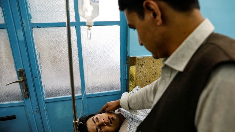 An injured man receives treatment in hospital