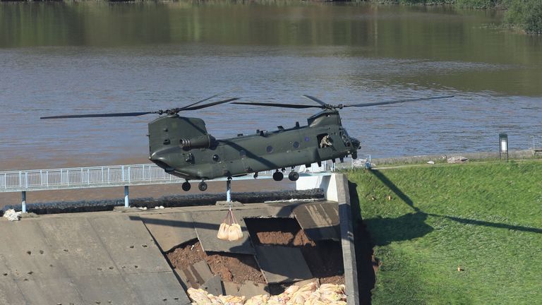 The RAF Chinook hovered low above the dam as is tried to repair the damage