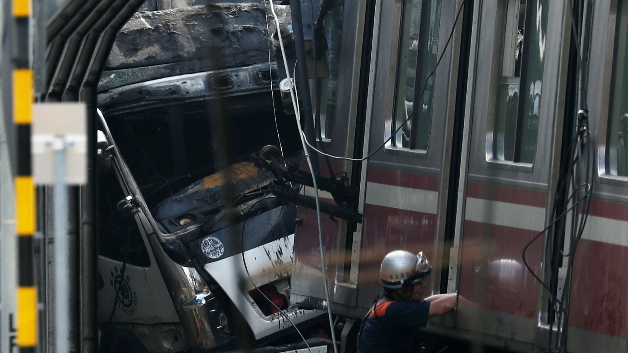 Japan train crash One dead, dozens injured after collision with truck