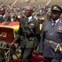 Vast swathes of Mugabe's funeral stadium empty as coffin on display
