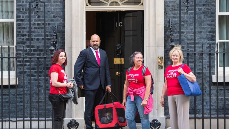 Eileen Jones (right) who runs Friends of Animals Wales and colleagues deliver a 15-week-old Jack Russell-cross puppy adopted by Prime Minister Boris Johnson and his partner Carrie Symonds to Downing Street, London.
