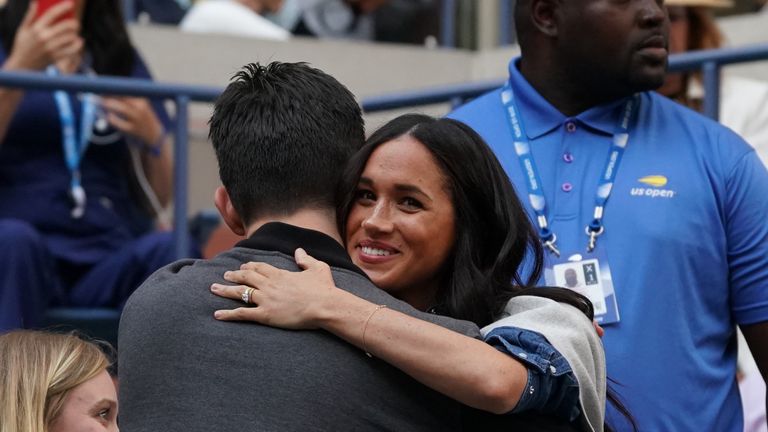 Meghan Markle, Duchess of Sussex hugs a friend as she watches Serena Williams of the US against Bianca Andreescu of Canada during the Women's Singles Finals match at the 2019 US Open at the USTA Billie Jean King National Tennis Center in New York on September 7, 2019. (Photo by TIMOTHY A. CLARY / AFP)        (Photo credit should read TIMOTHY A. CLARY/AFP/Getty Images)
