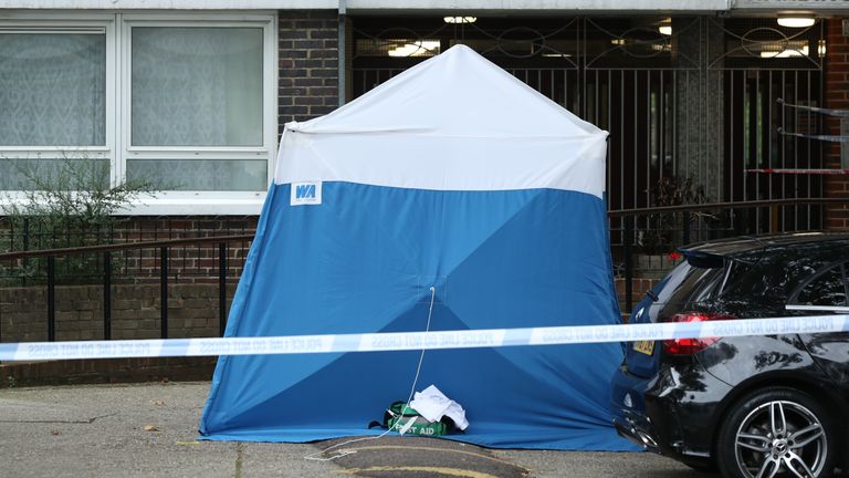 A police tent at the scene on Belmont Street, Camden, north-west London, where a woman, believed to be in her 20s, was stabbed to death late on Sunday night.