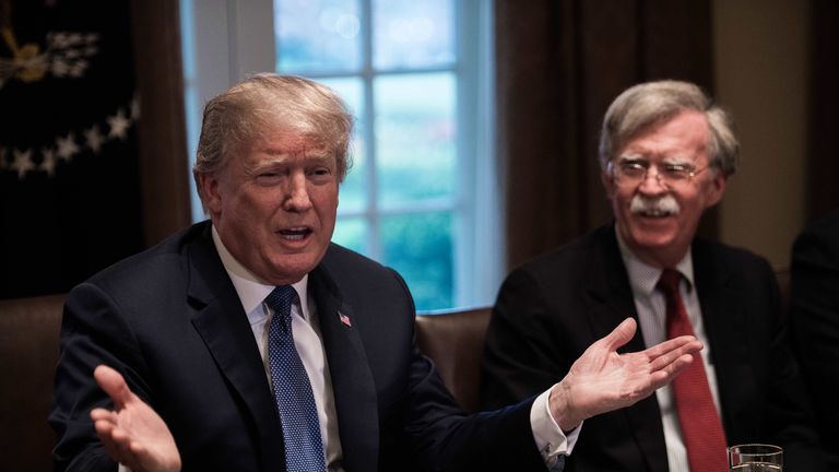 US President Donald Trump speaks during a meeting with senior military leaders at the White House in Washington, DC, on April 9, 2018. At right is new National Security Advisor John Bolton.President Donald Trump said Monday that "major decisions" would be made on a Syria response in the next day or two, after warning that Damascus would have a "big price to pay" over an alleged chemical attack on a rebel-held town.Trump condemned what he called a "heinous attack on innocent" Syrians in Douma, as he opened a cabinet meeting at the White House. / AFP PHOTO / NICHOLAS KAMM (Photo credit should read NICHOLAS KAMM/AFP/Getty Images)