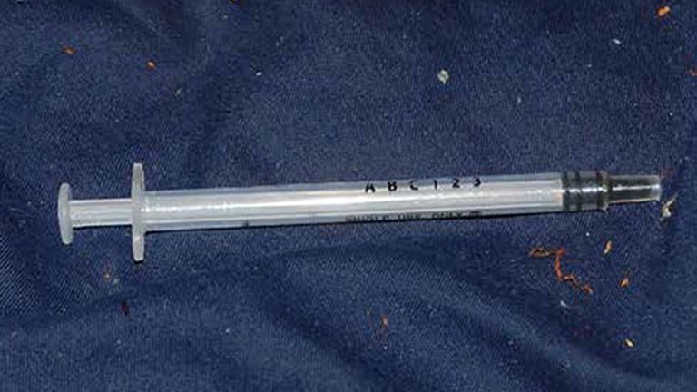 Metropolitan Police undated handout photo of a syringe found in the flat of Brandon Dunbar who targeted 12 men over a 19-month period with Gerald Matovu. Matovu was found guilty at the Old Bailey, London, for the murder of Eric Michels after he plied him with a fatal dose of GHB at his home in Bolton Road, Chessington, Surrey, then made off with his bank card details and other belongings.