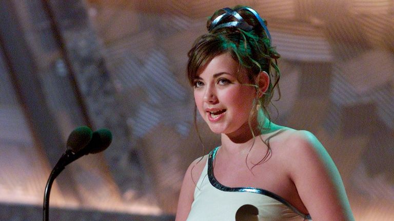 Welsh opera singer Charlotte Church sings during the annual pretelecast Grammy Awards show in Los Angeles February 21, 2001. Church, who helped present awards to winners announced before the television show, gave an impromptu performance after the crowd sang 